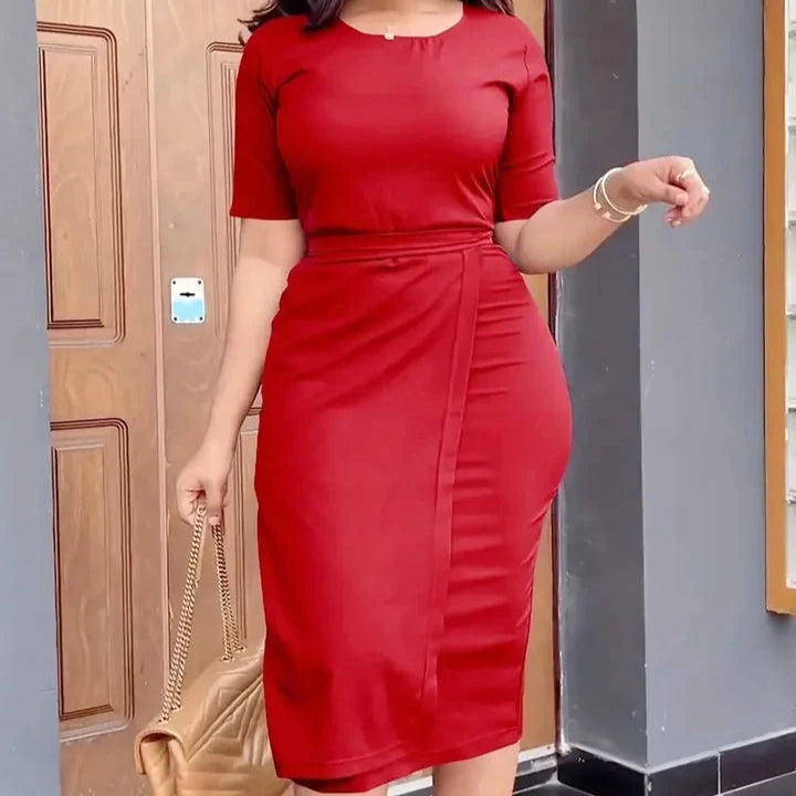 Cropped model in a fitted red midi dress with short sleeves and a waist tie