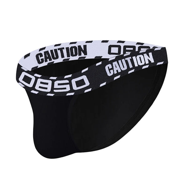 Close-up of black low-waisted briefs with a white-and-black OBOSO CAUTION logo waistband