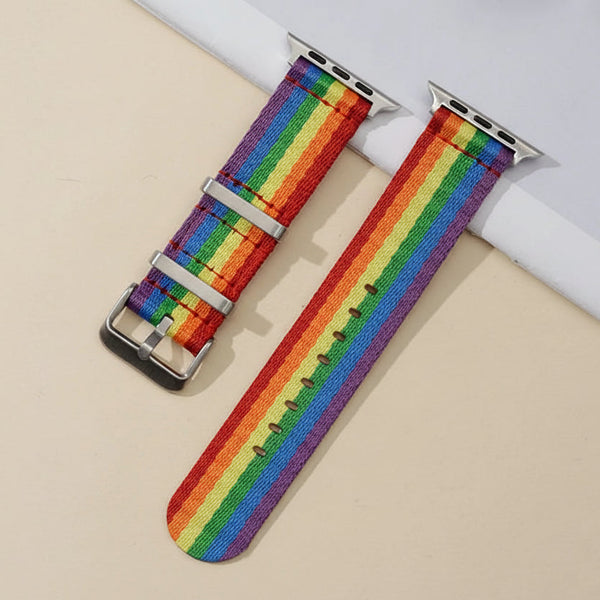 Rainbow Pride Apple Watch band with silver connectors and buckle, shown flat