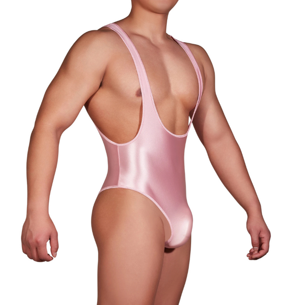 Front three-quarter view of a person wearing a shiny pale-pink U-neck bodysuit