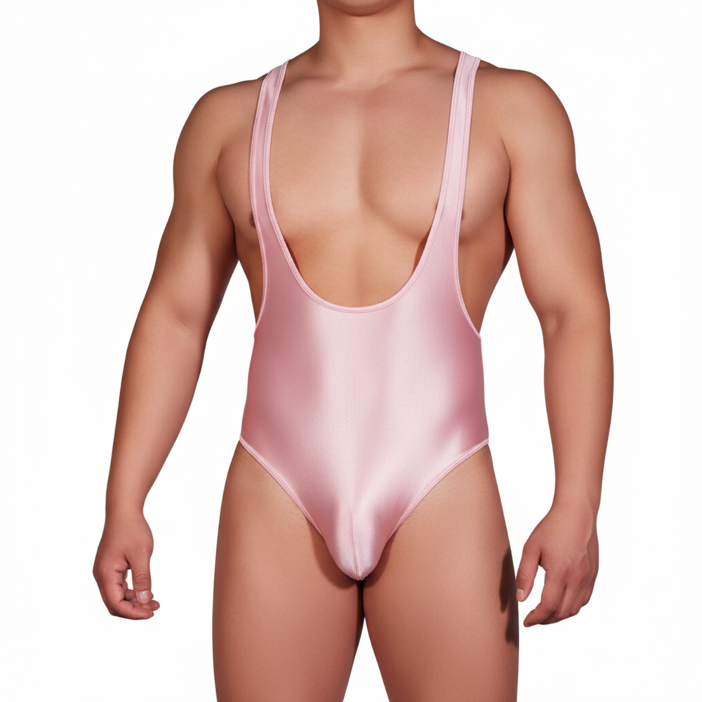 Front view of a model wearing a shiny pale pink U-neck bodysuit