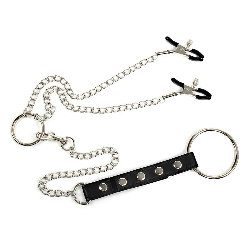 Close-up of black nipple clamps with silver chain, O-rings, and adjustable strap
