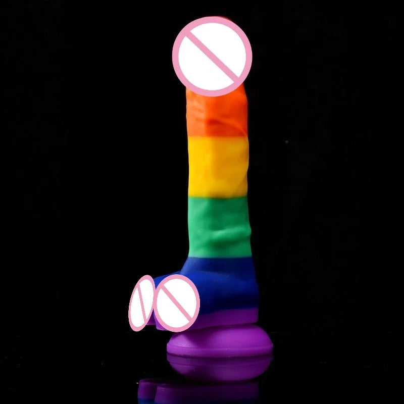 Rainbow Pride dildo with flared purple base, shown upright against a black background
