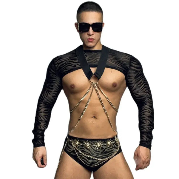 Front-facing model wearing a black zebra-print performance costume with chains and sunglasses