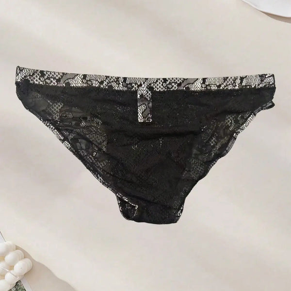 Front view of black floral lace briefs laid flat on a light surface