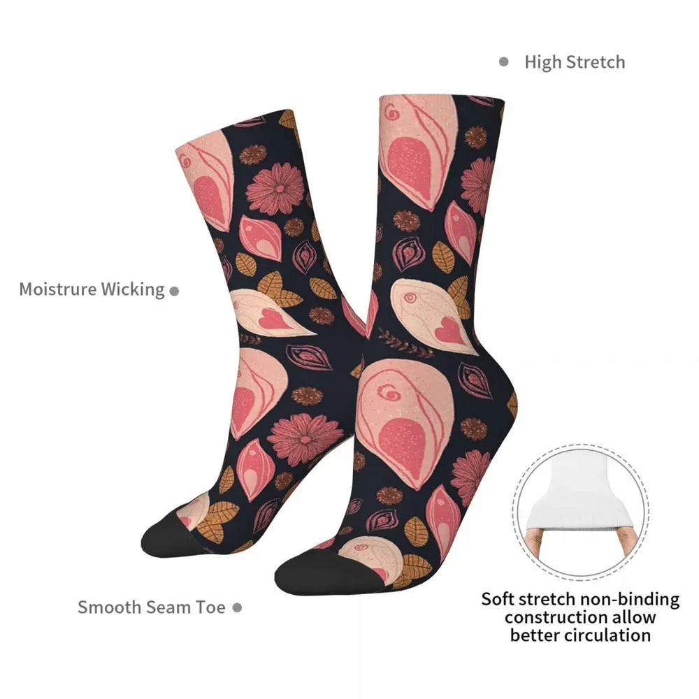 Pair of black socks with pink vulva, flower, leaf, and heart motifs