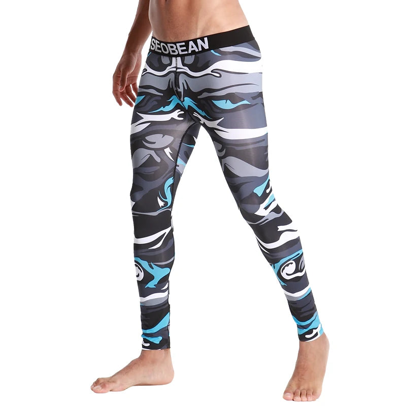 Front view of a model wearing blue, gray, black, and white camouflage leggings with a branded waistband