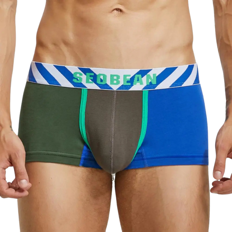 Front view of a model wearing color-block men's boxer briefs with a SEOBEAN waistband