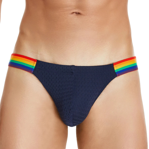 Front view of navy low-rise briefs with rainbow-striped sides on a model