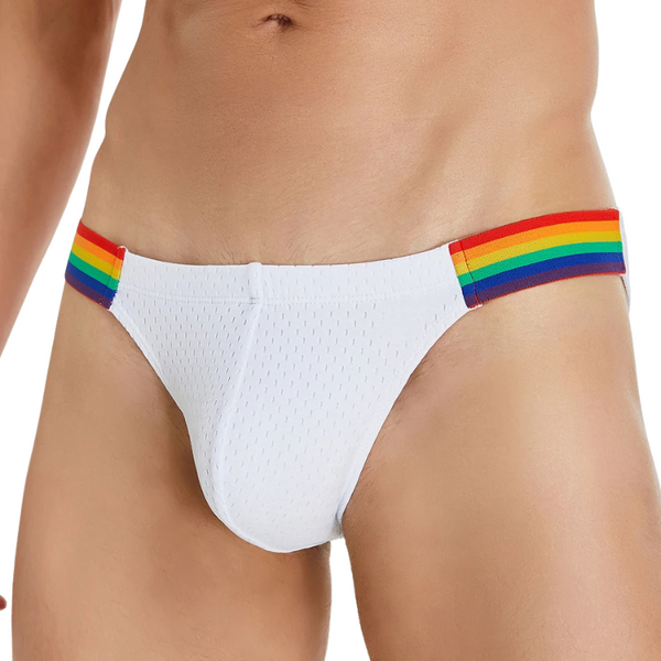 Front view of a model wearing white low-rise briefs with rainbow-striped side bands