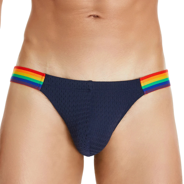 Front view of navy low-rise briefs with rainbow-striped sides on a model
