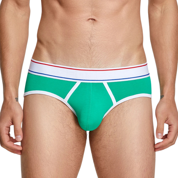 Front view of a model wearing bright green men's briefs with white trim and striped waistband