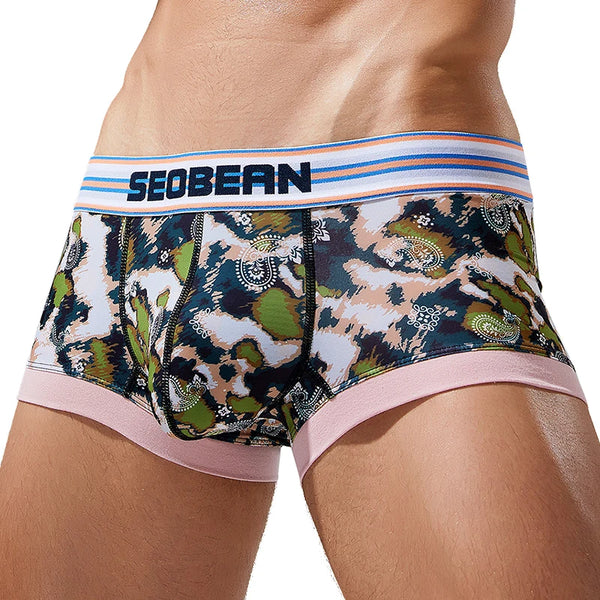 Front view of a model wearing camouflage-print mesh briefs with a striped SEOBEAN waistband