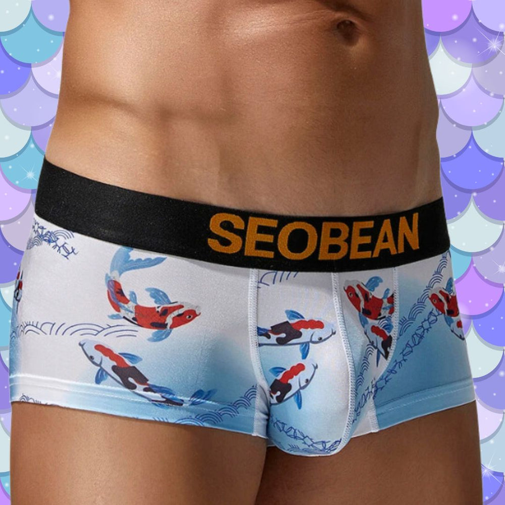 Front close-up of light blue koi-print boxer briefs with a black SEOBEAN waistband
