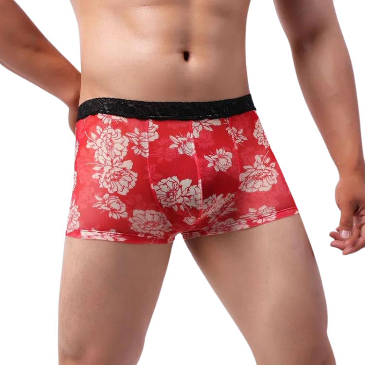 Red boxer briefs with white floral print and black lace-trimmed waistband
