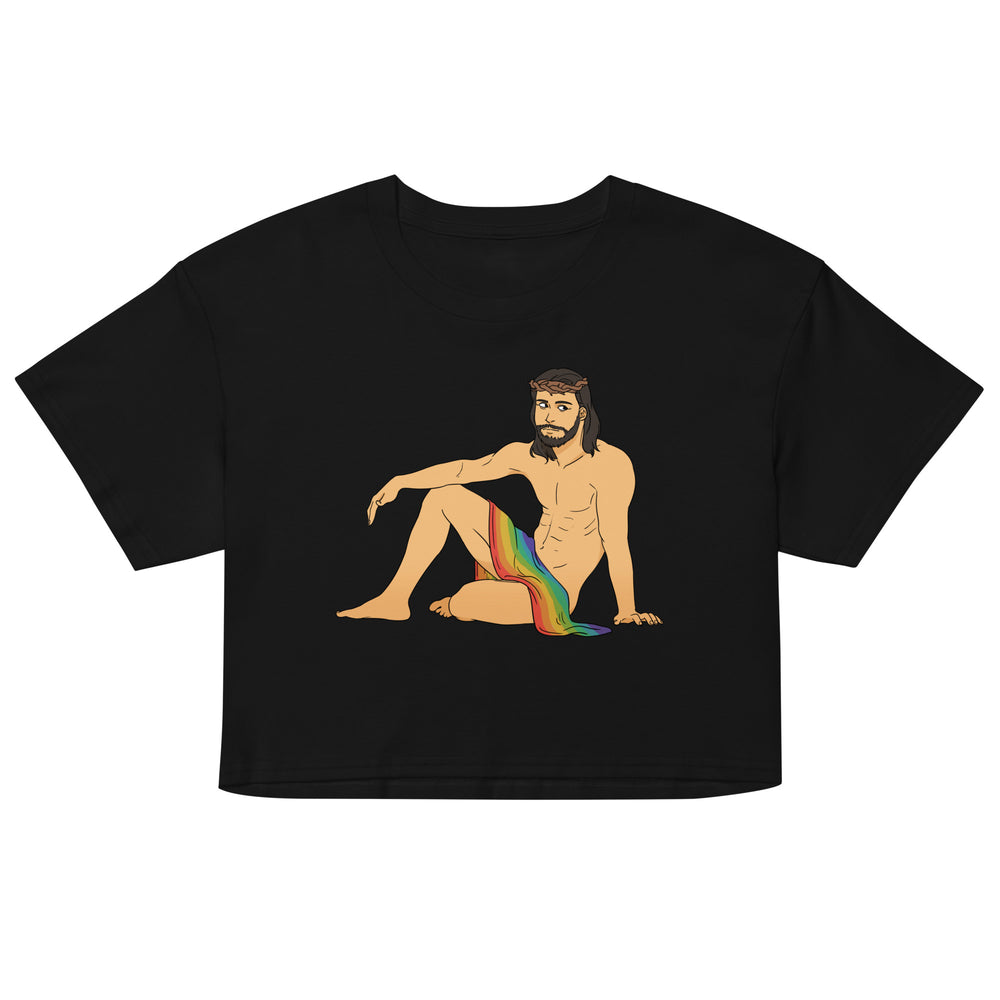 Front view of a black crop top with a seated, shirtless Jesus illustration draped in a rainbow flag