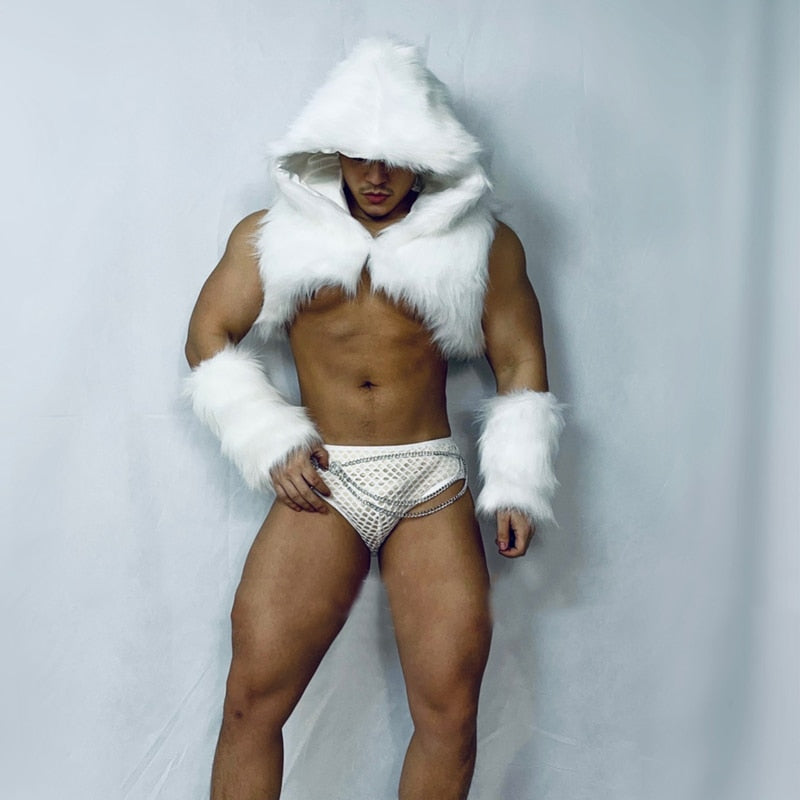 Front-view model wearing a white faux-fur hooded shrug, cuffs, and strappy brief