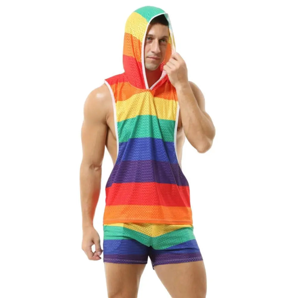 Front-facing model wearing a rainbow-striped mesh hooded tank and matching short shorts