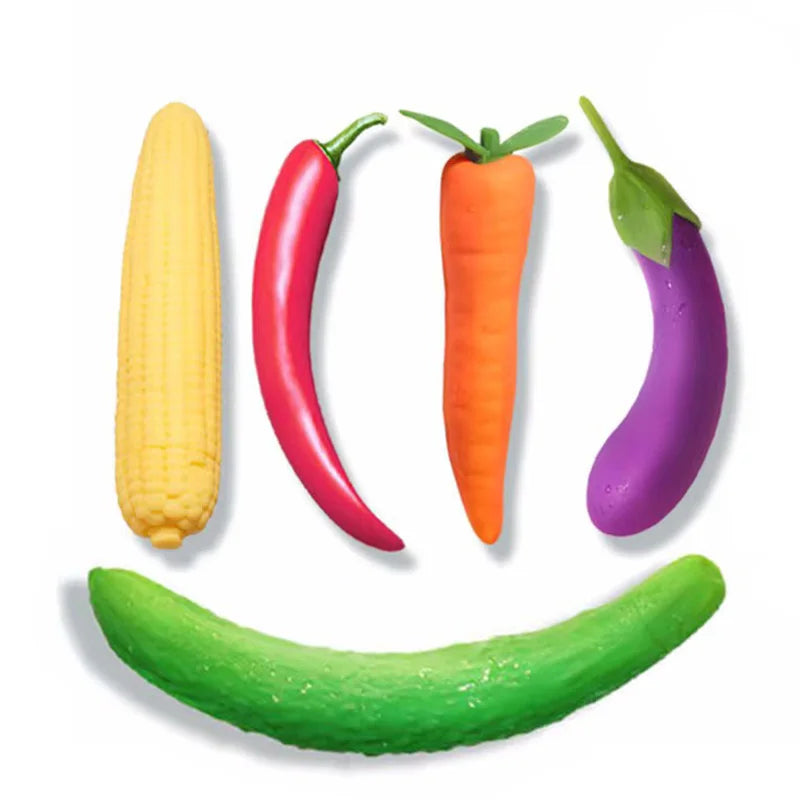 Chili vibrator product graphic with corn, red chili, carrot, eggplant, and cucumber on white