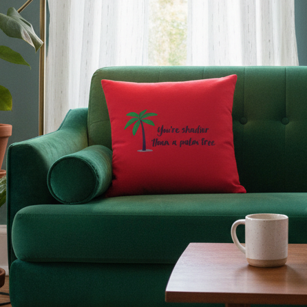 Green velvet sofa with premium cushion, featuring red "Shadier Than A Palm Tree" pillow and palm tree design