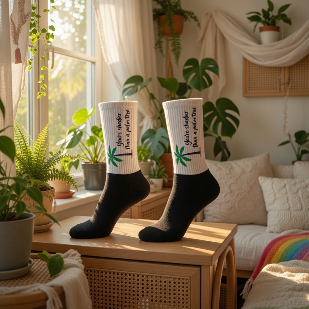 Shadier Than A Palm Tree Socks with vivid green leaf prints and “Save the Planet, Plant a Plant” text on feet