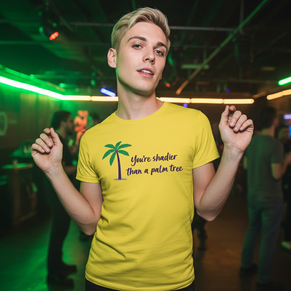 Shadier Than A Palm Tree T-Shirt with palm graphic and "You're shadier than a palm tree." Short blond hair