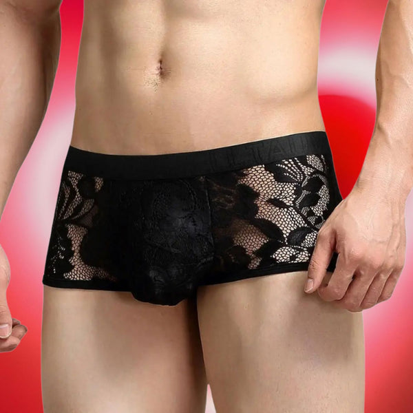 Front view of a model wearing black sheer floral lace boxer briefs