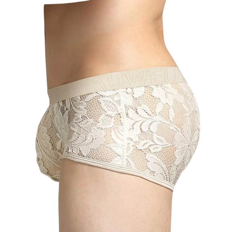 Rear three-quarter view of a model wearing sheer white floral lace boxer briefs