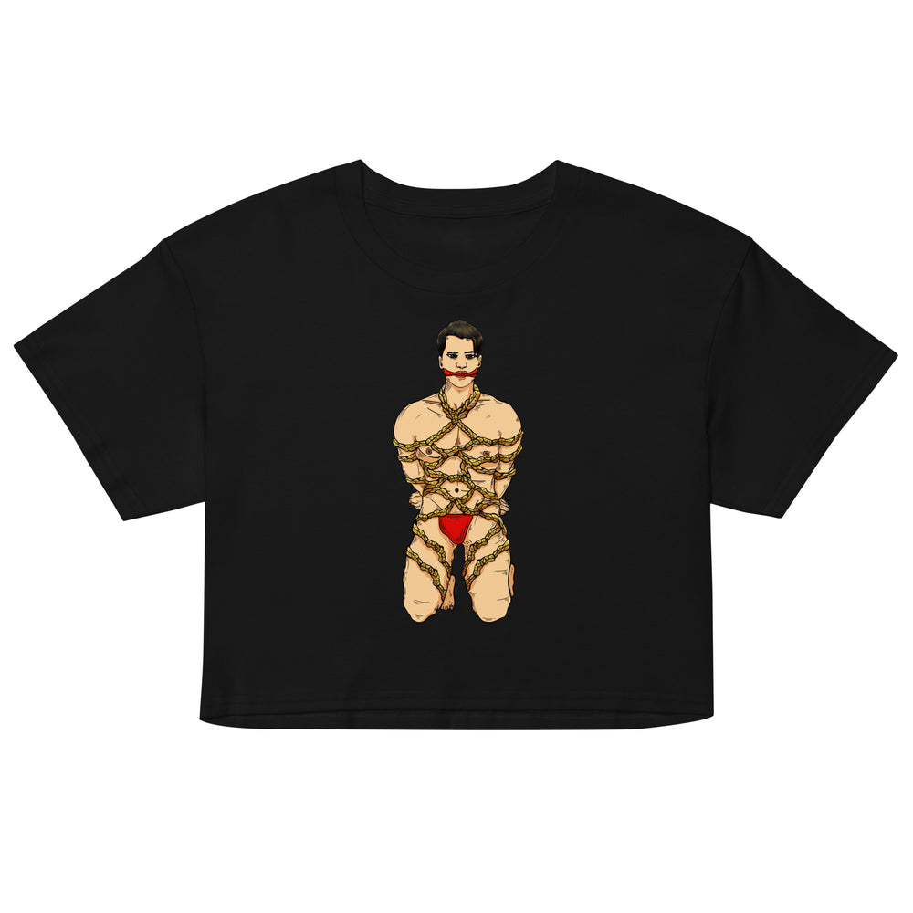 Front-facing black crop top with a bound, kneeling figure graphic in ropes and red underwear