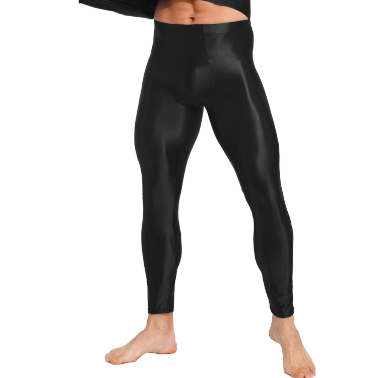 Front view of a model wearing shiny black full-length compression leggings