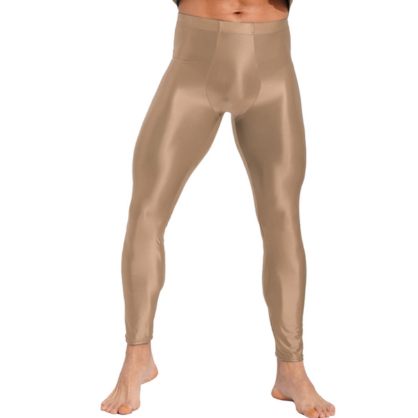 Front view of a model wearing shiny tan men's compression leggings, cropped above the waist