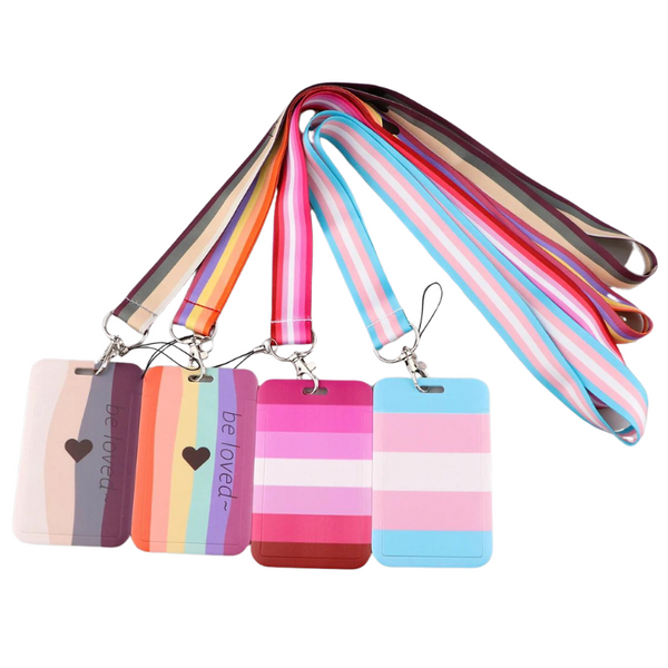 Four pastel-striped ID badge holders with matching rainbow lanyards, two reading “be loved”
