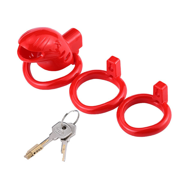 Red silicone chastity cage with three interchangeable rings and two keys on white