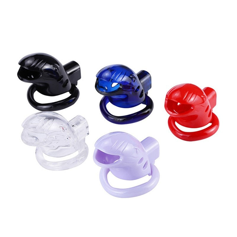 Five small silicone cock cages in black, blue, red, clear, and lavender on white