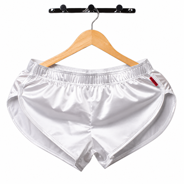 Front view of shiny white satin boxers hanging from a wooden hanger