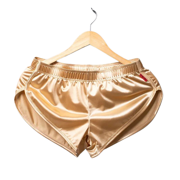 Front view of shiny champagne-gold boxers hanging from a wooden hanger