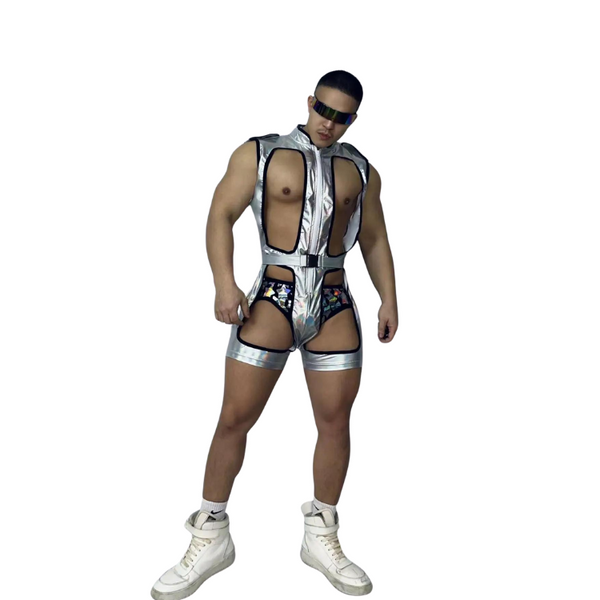 Front view of a model wearing a silver metallic cutout bodysuit with shorts and sunglasses