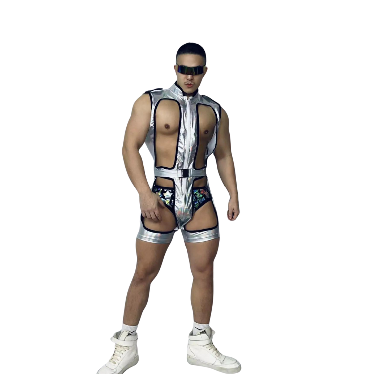 Front-view model wearing a reflective silver cutout bodysuit with visor sunglasses and white sneakers