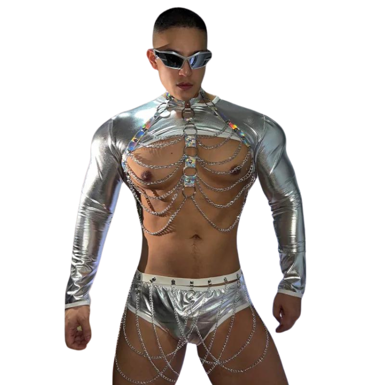 Front-facing model in silver metallic rave outfit with chain chest harness and briefs