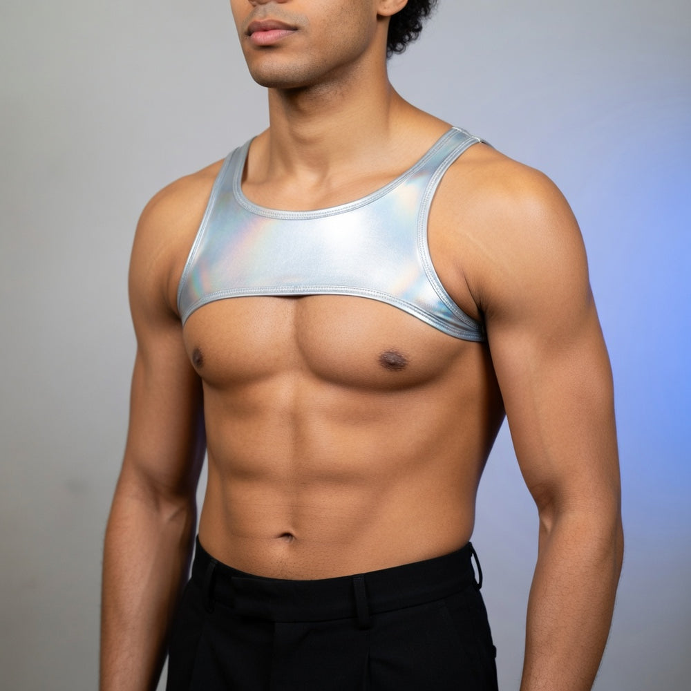 Model wearing a silver metallic upper-chest tank harness with black trousers.
