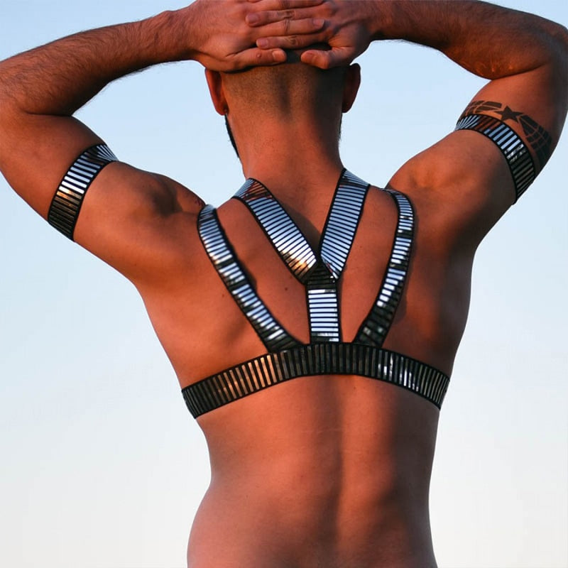 Rear view of a model wearing a reflective silver-and-black chest harness