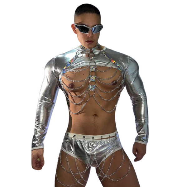 Front-facing model in silver metallic rave outfit with chain chest harness and briefs