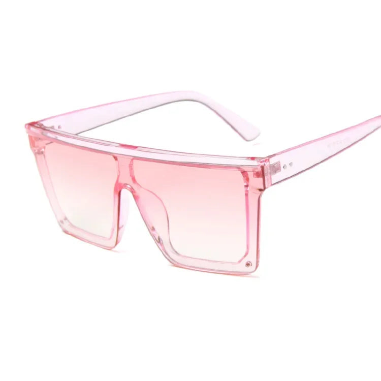 Translucent pink oversized square sunglasses shown at a three-quarter angle