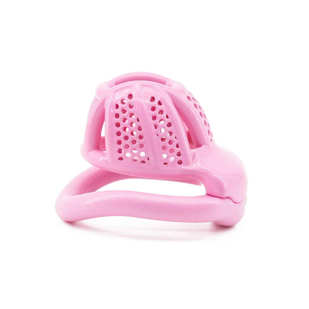 Pink plastic chastity cage with a perforated dome, shown from the front on white