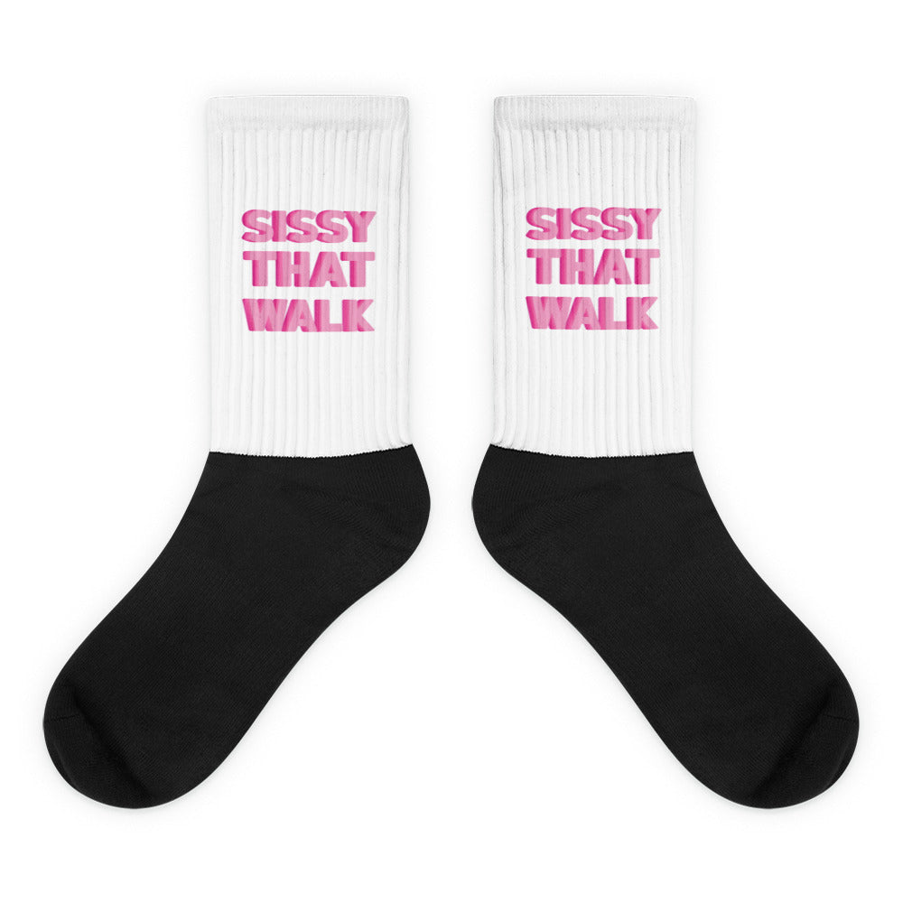 Pair of white ribbed crew socks with pink “SISSY THAT WALK” text and black feet