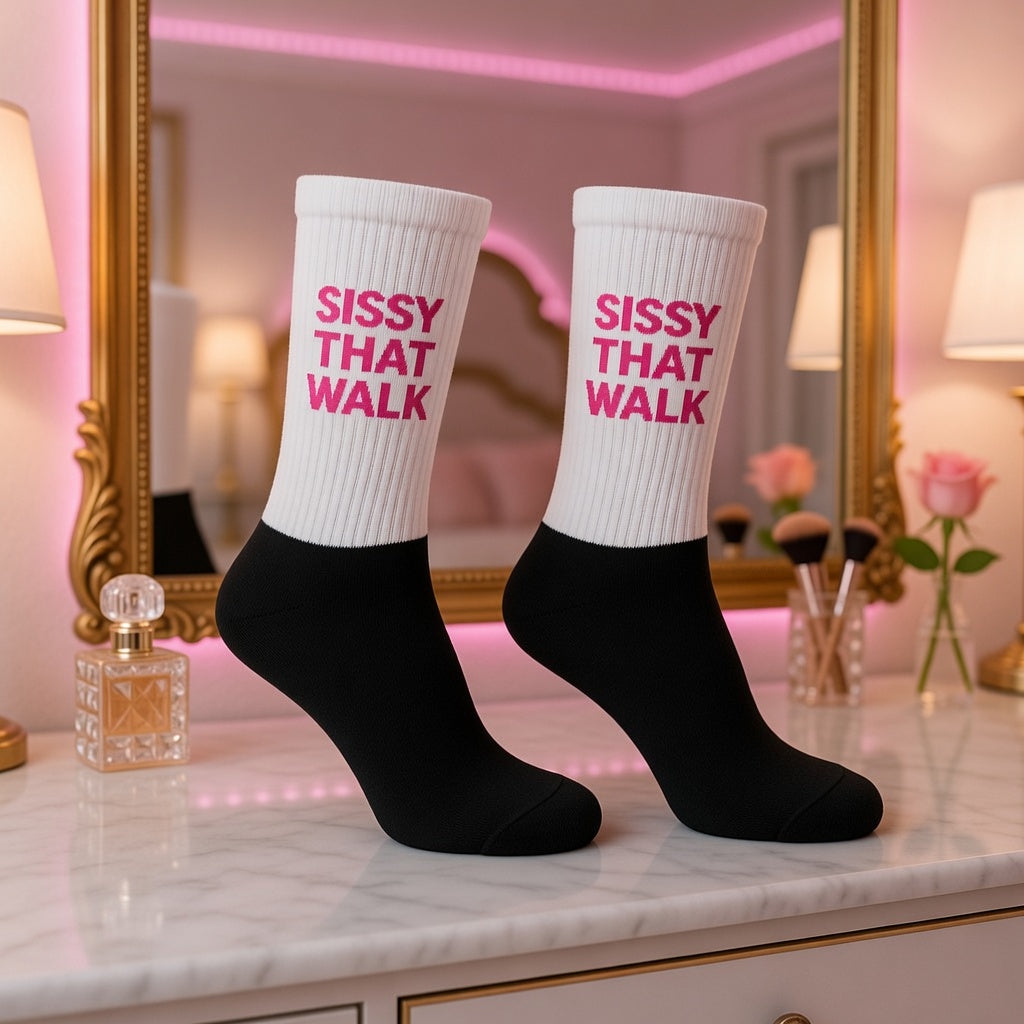 Crew-length black and white socks with “SISSY THAT WALK” in pink, standing on marble amid roses, perfume, mirror, and makeup.
