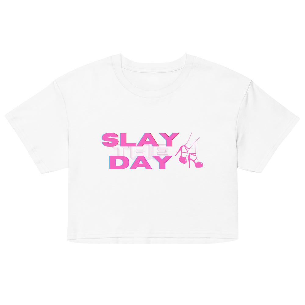 Front view of a white crop top reading “SLAY THE DAY” with pink high-heel graphics
