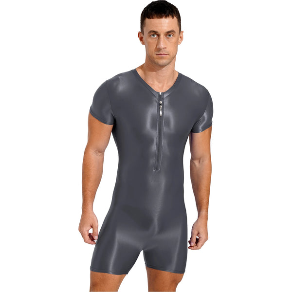 Front-facing person modeling a dark gray short-sleeve bodysuit with a center zipper