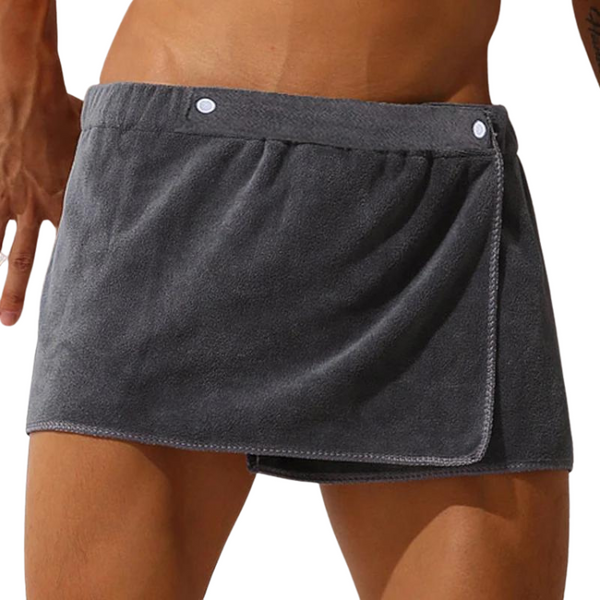 Close-up front view of a person wearing charcoal-gray wrap-style shorts with two snap buttons