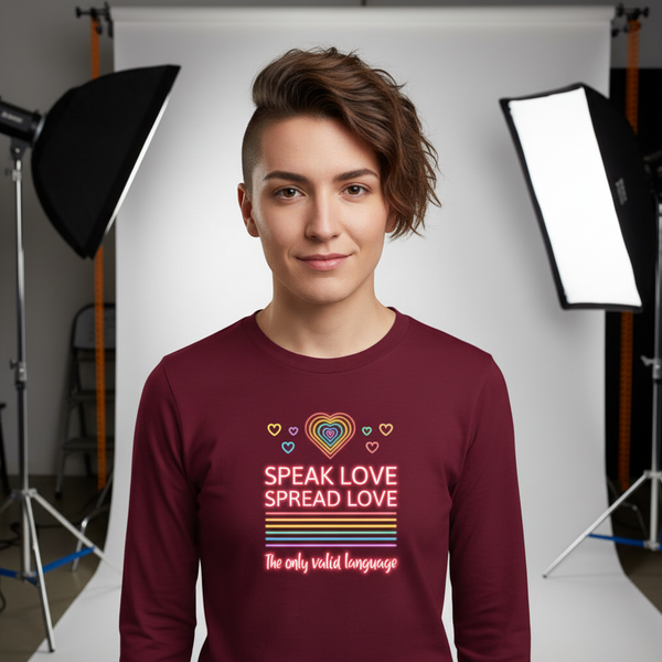 Model wearing a burgundy long-sleeve shirt with neon hearts and “Speak Love Spread Love” text